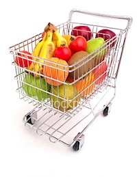 Shopping cart full of fresh fruit groceries.